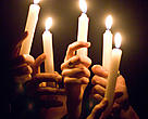 Earth Hour 2009. Hands holding candles, Canada.